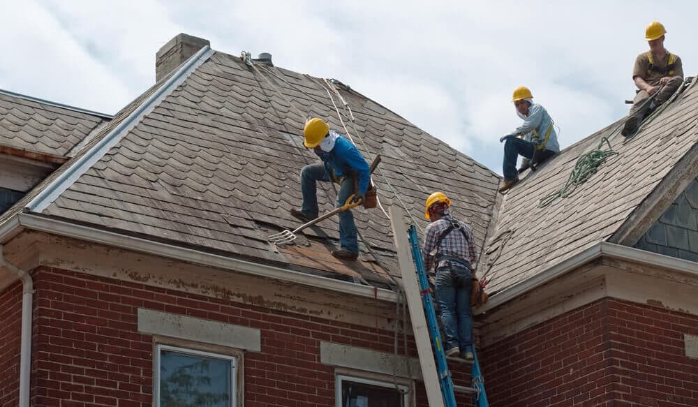 Workers Restoring Roof