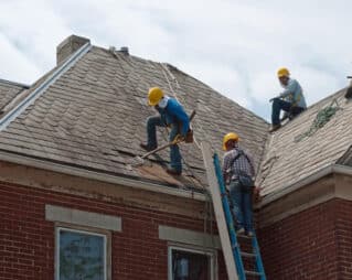 Workers Restoring Roof